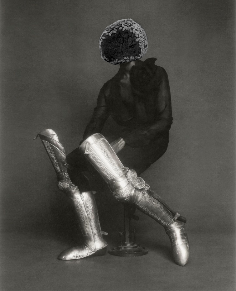 man wearing black outfit with silver leg armor